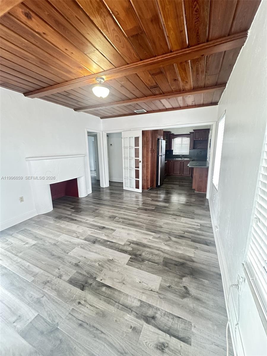 4232 Northwest 2nd Terrace, Unit A Miami, FL 33126 - Photo 2 of 11 a view of a room with wooden furniture