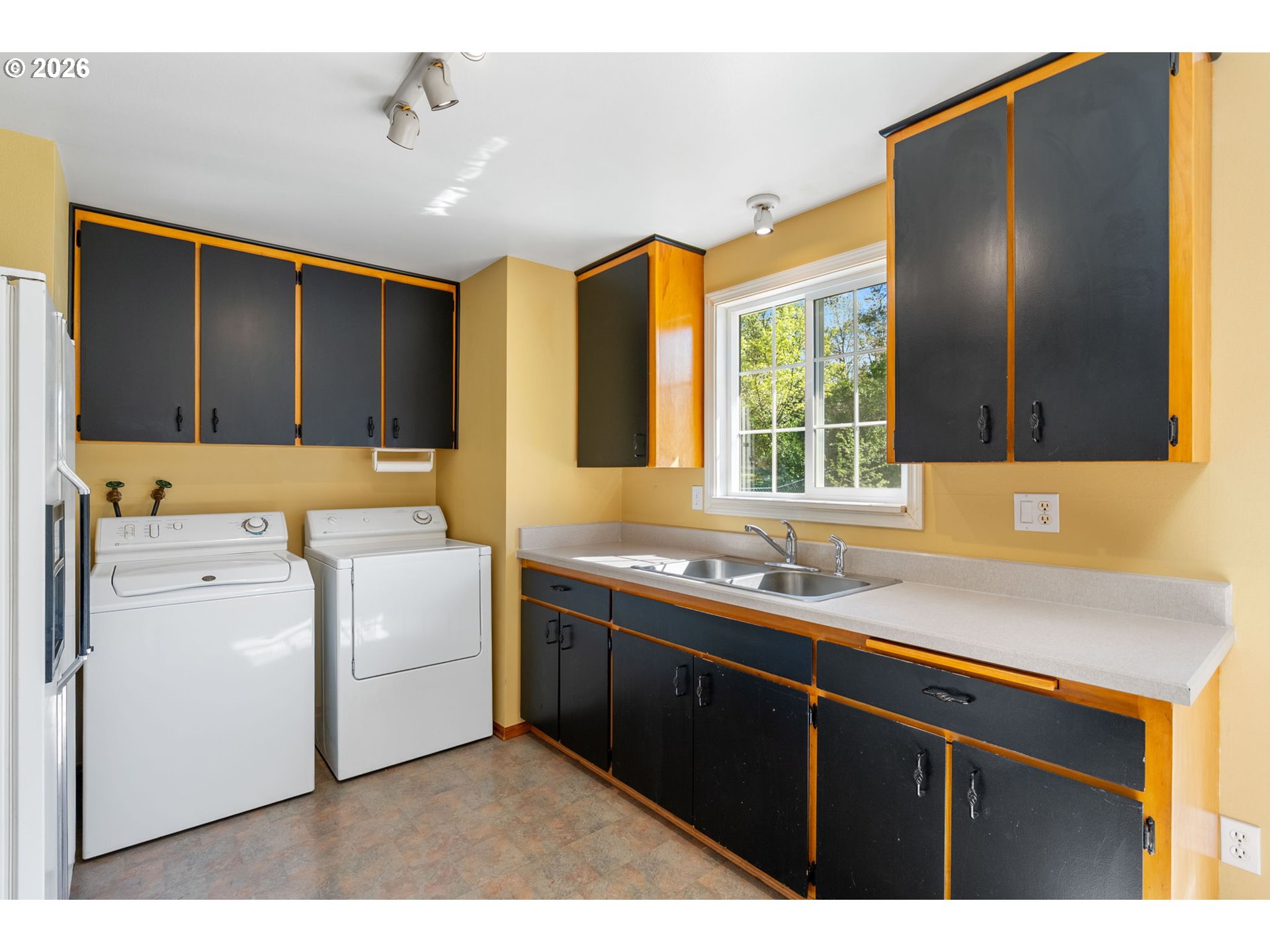 2419 Prospect Avenue Hood River, OR 97031 - Photo 14 of 27 a kitchen with a sink appliances and cabinets