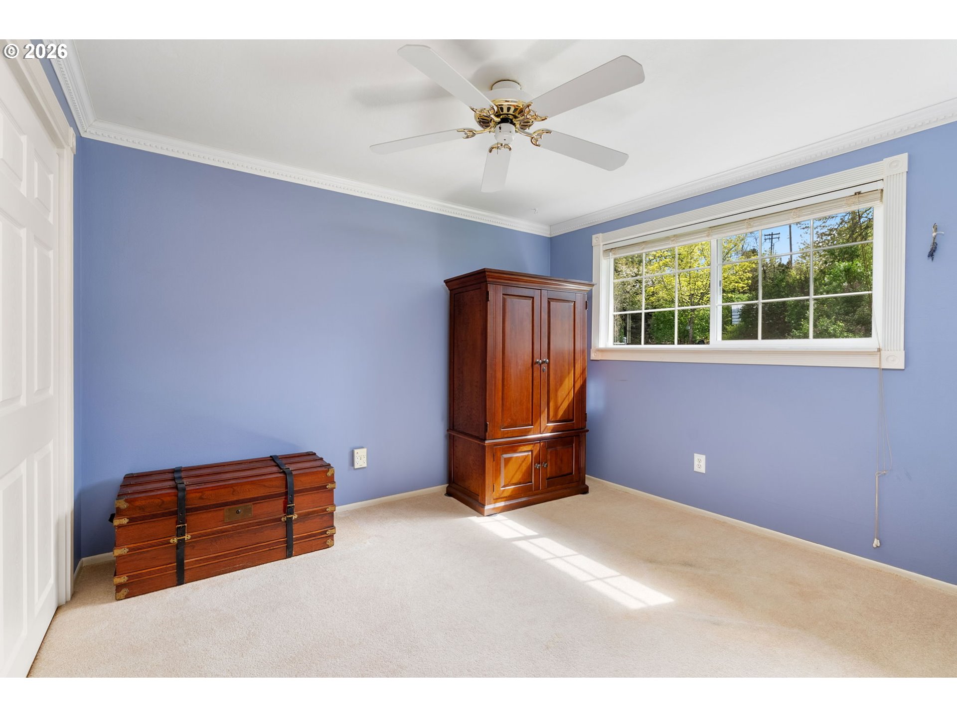 2419 Prospect Avenue Hood River, OR 97031 - Photo 17 of 27 a room with a window and a chandelier