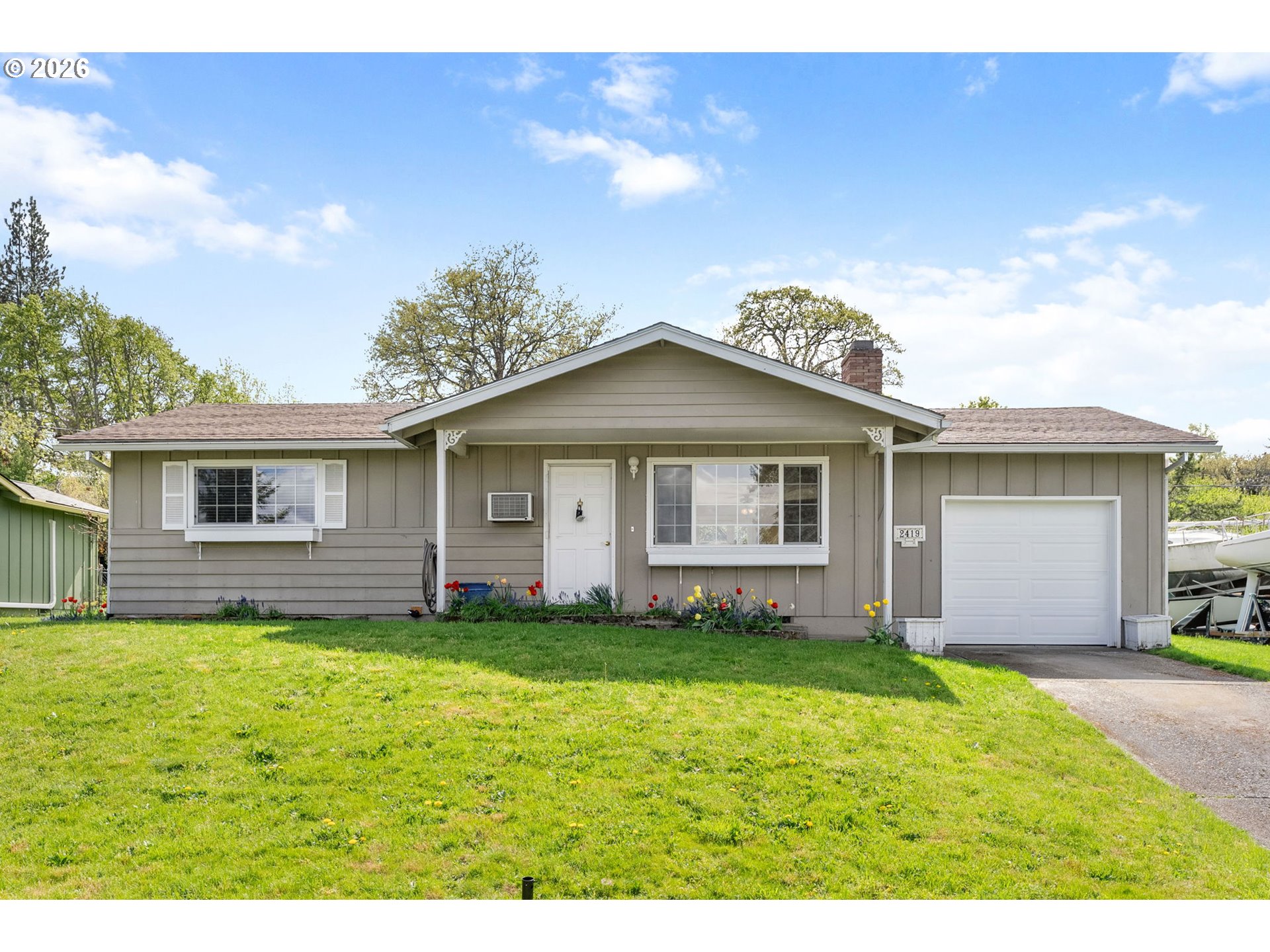 2419 Prospect Avenue Hood River, OR 97031 - Photo 2 of 27 a front view of a house with a yard and garage