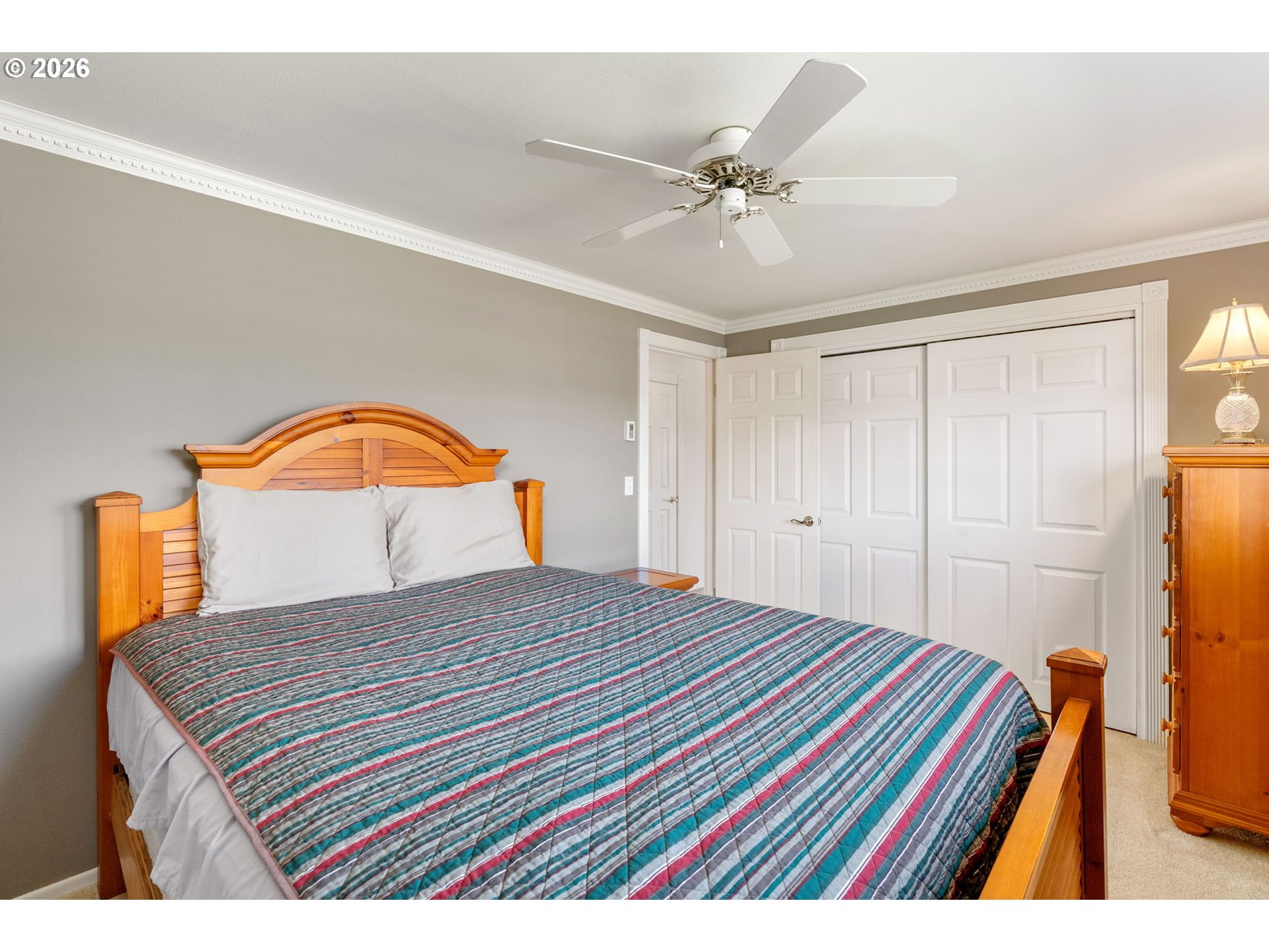 2419 Prospect Avenue Hood River, OR 97031 - Photo 22 of 27 a bedroom with a bed and a chandelier