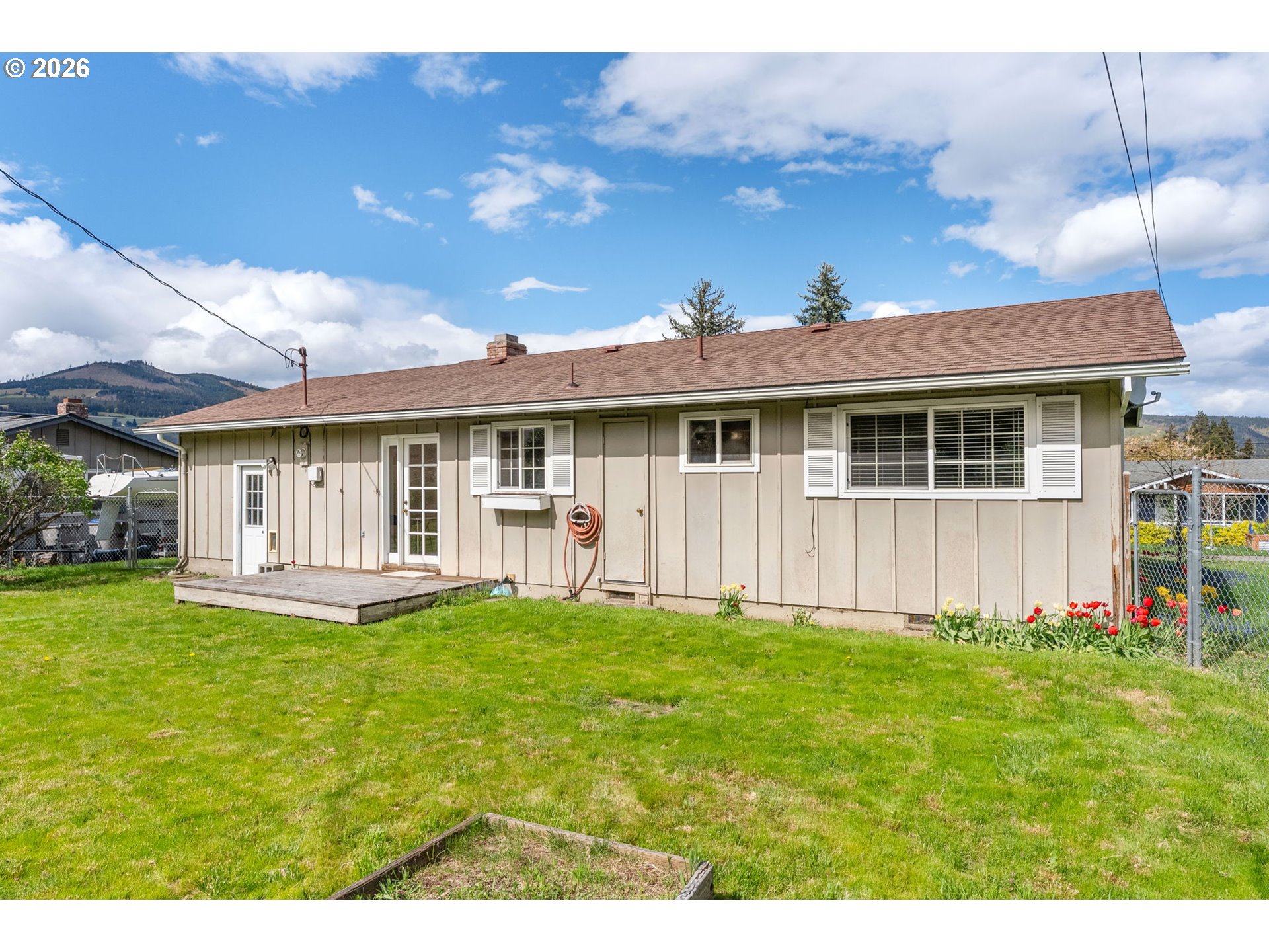 2419 Prospect Avenue Hood River, OR 97031 - Photo 4 of 27 a view of a house with a yard and sitting area