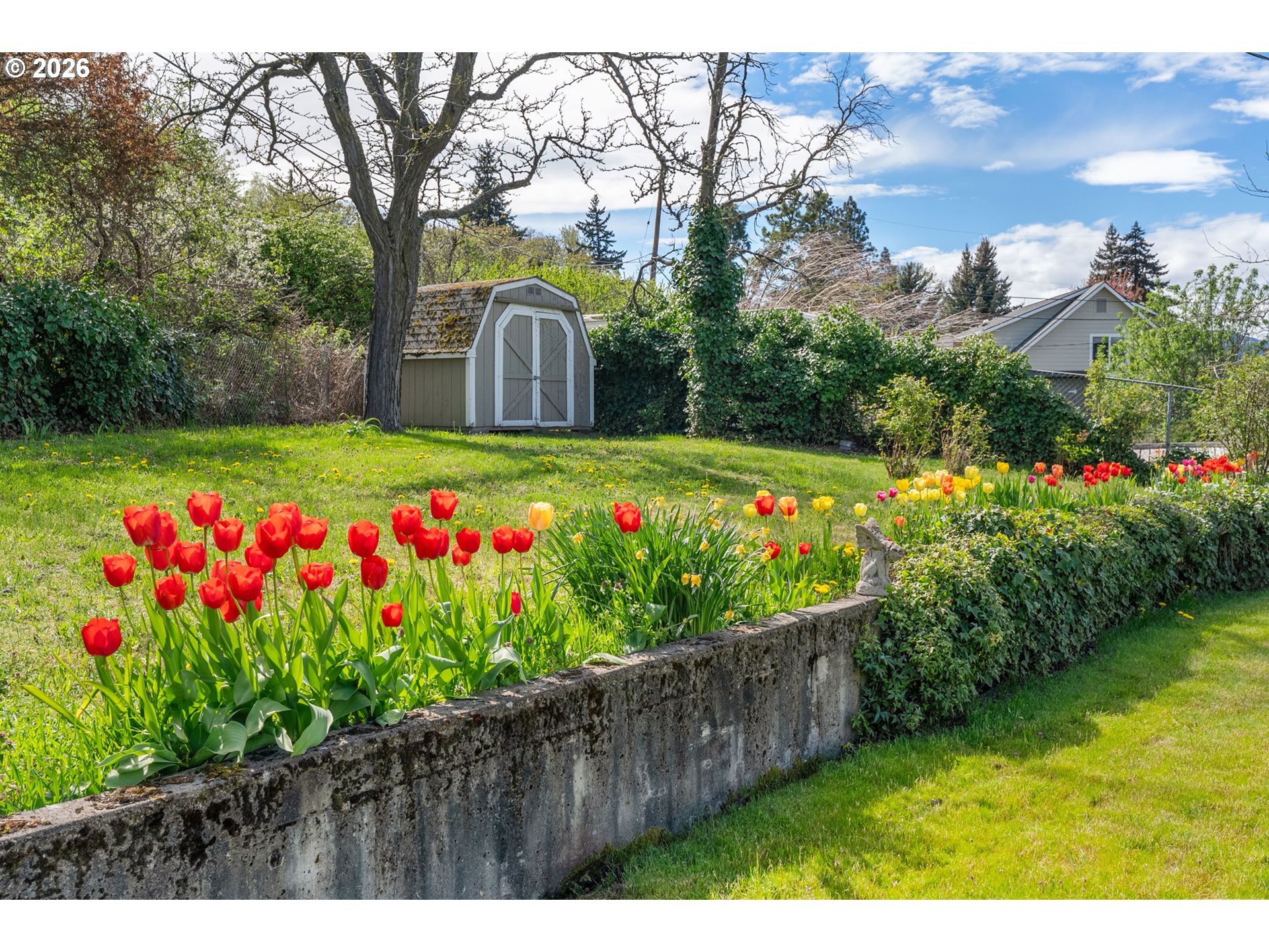 2419 Prospect Avenue Hood River, OR 97031 - Photo 5 of 27 a green field with flowers