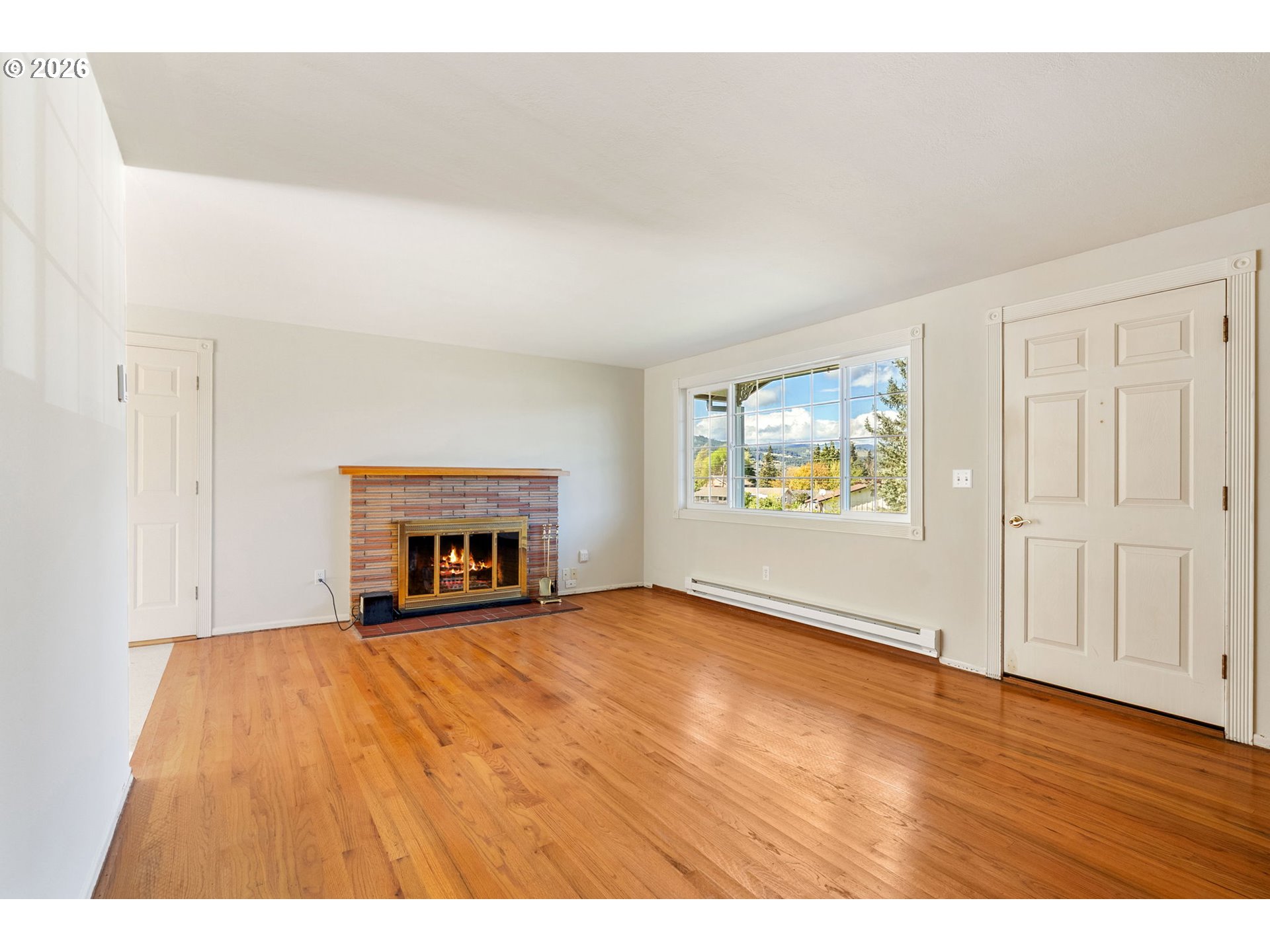 2419 Prospect Avenue Hood River, OR 97031 - Photo 10 of 27 a view of an empty room with a window and a fireplace