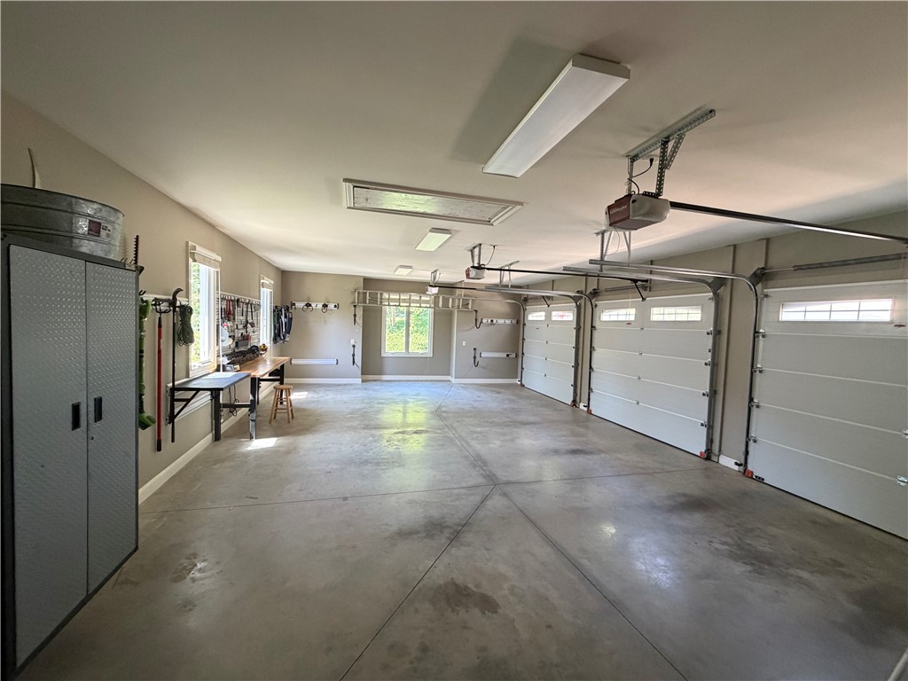357 Stardust Lane Seneca, SC 29672 - Photo 45 of 50 Garage - An expansive muti-car garage provides substantial space with concrete flooring and integrated workshop areas.