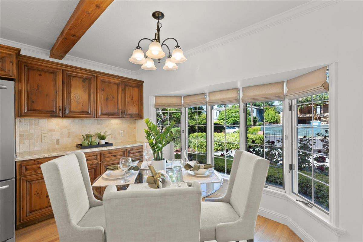 121 Jane Ann Way Campbell, CA 95008 - Photo 11 of 38 a view of a dining room with furniture large windows and wooden floor