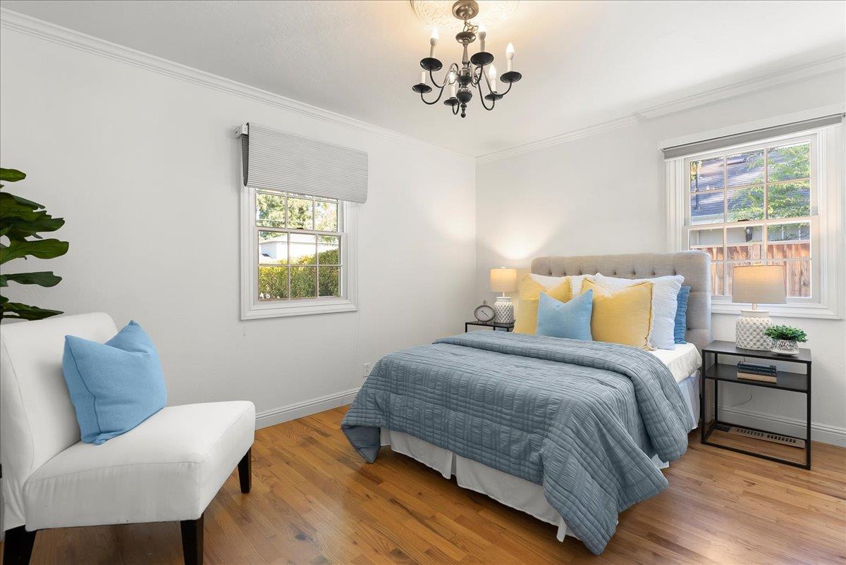 121 Jane Ann Way Campbell, CA 95008 - Photo 16 of 38 a bedroom with a bed and wooden floor