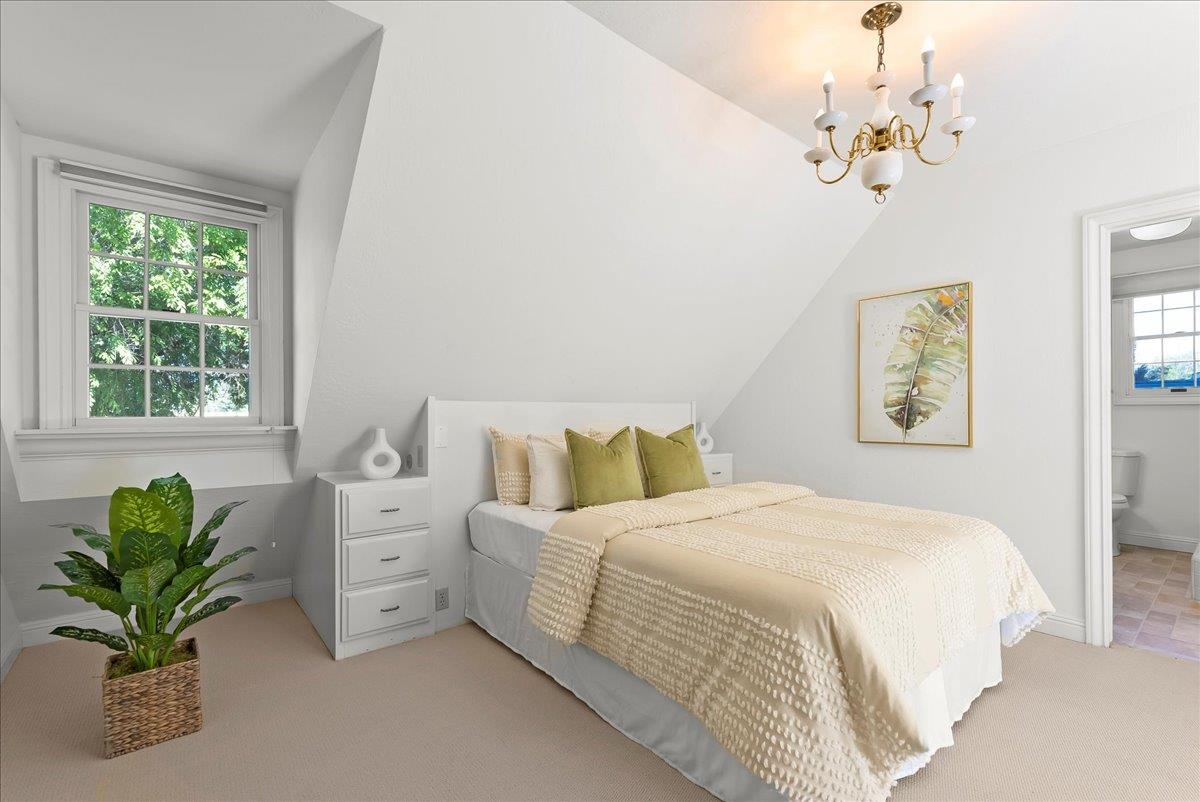 121 Jane Ann Way Campbell, CA 95008 - Photo 20 of 38 a bedroom with a bed and a chandelier