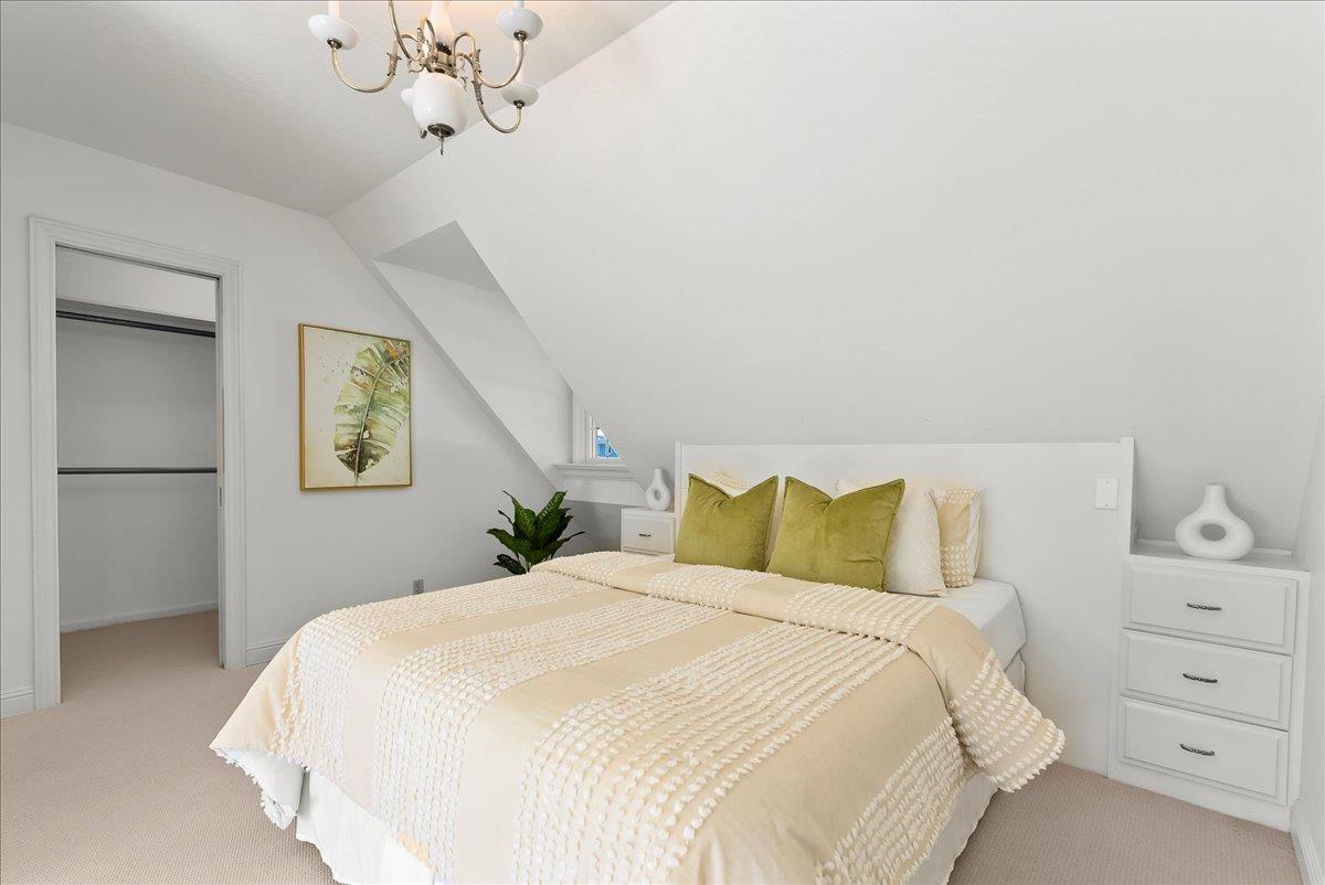 121 Jane Ann Way Campbell, CA 95008 - Photo 21 of 38 a bedroom with a bed and a chandelier