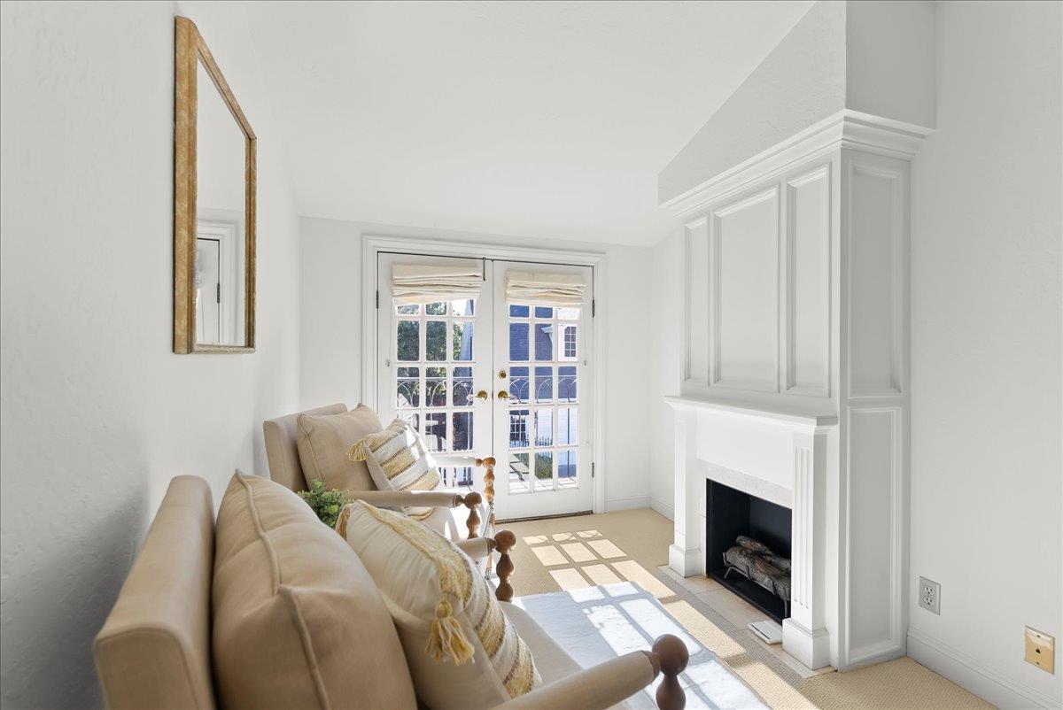 121 Jane Ann Way Campbell, CA 95008 - Photo 22 of 38 a living room with furniture a fireplace and a large window