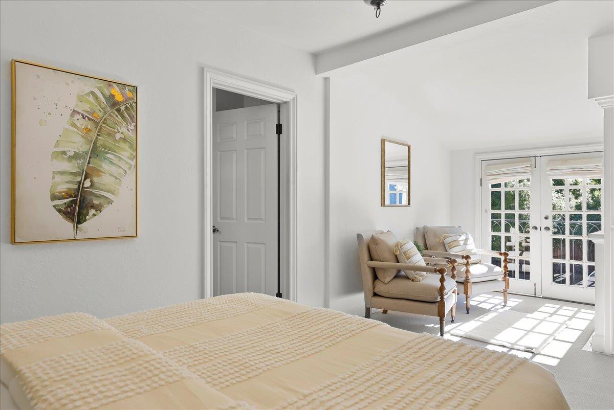 121 Jane Ann Way Campbell, CA 95008 - Photo 23 of 38 a bedroom with a bed and a chair