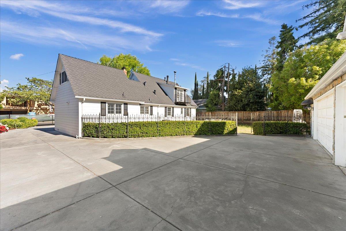121 Jane Ann Way Campbell, CA 95008 - Photo 30 of 38 a view of yellow house with a big yard and a large tree
