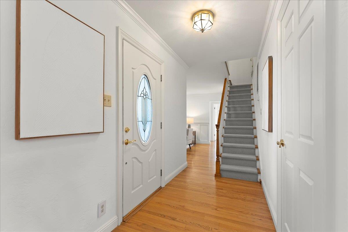 121 Jane Ann Way Campbell, CA 95008 - Photo 5 of 38 a view of a hallway with wooden floor and staircase