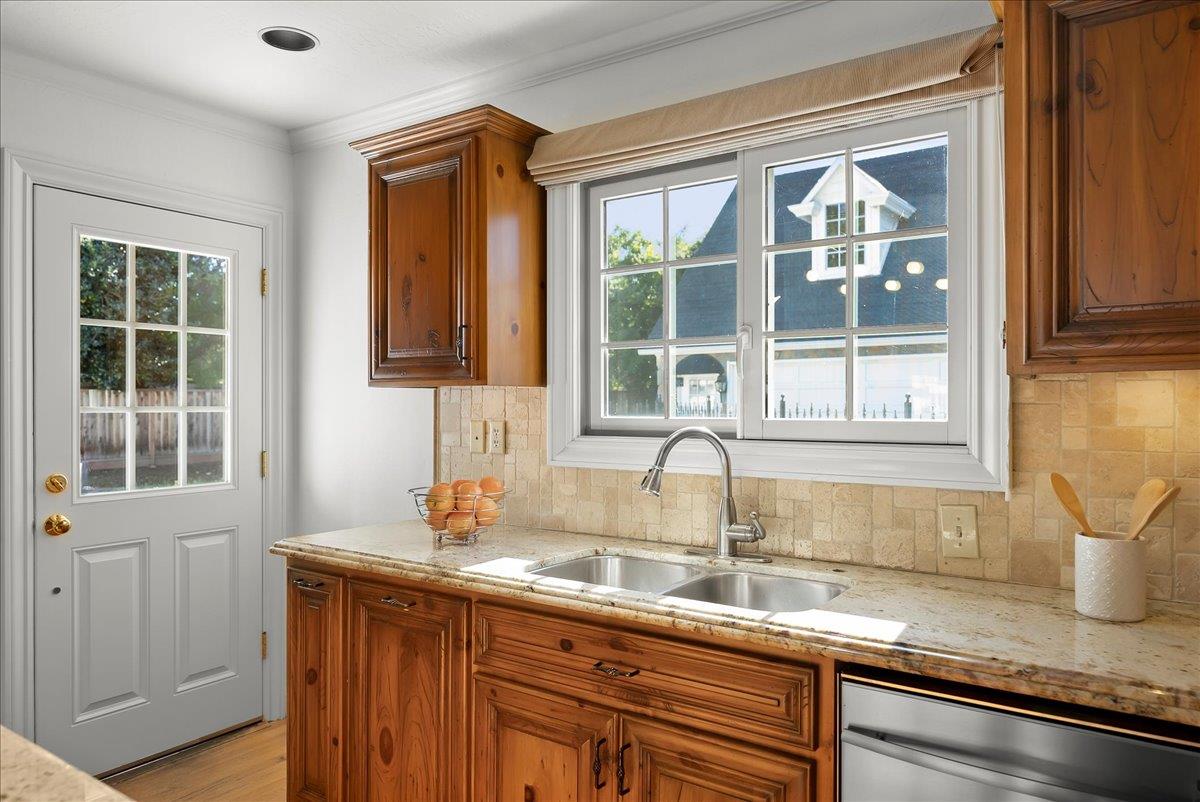 121 Jane Ann Way Campbell, CA 95008 - Photo 7 of 38 a kitchen with granite countertop a sink and a window