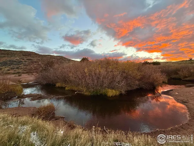 a view of a backyard with wooden floor and mountain view