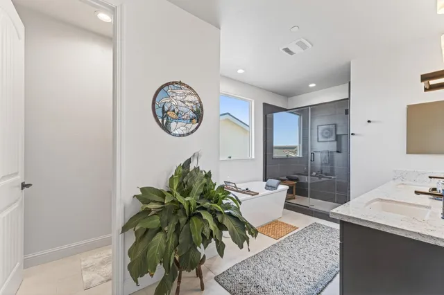 a very nice looking room with a large window table and chairs