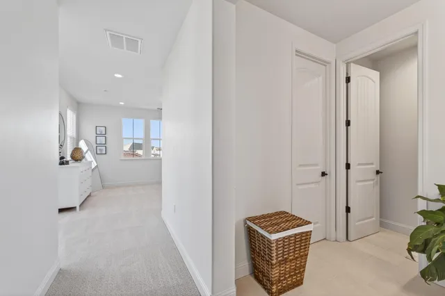 a view of room with window and hallway