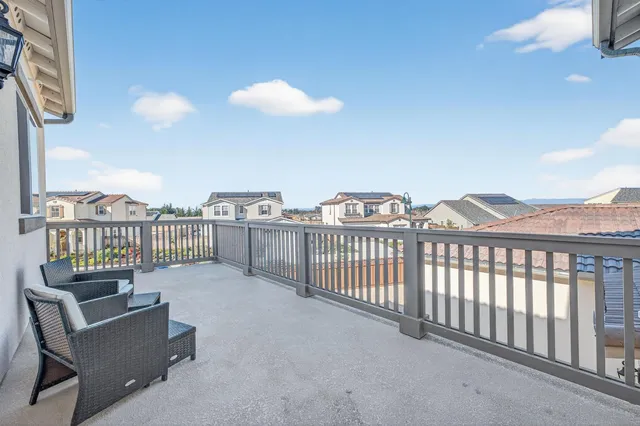 a view of a balcony with furniture