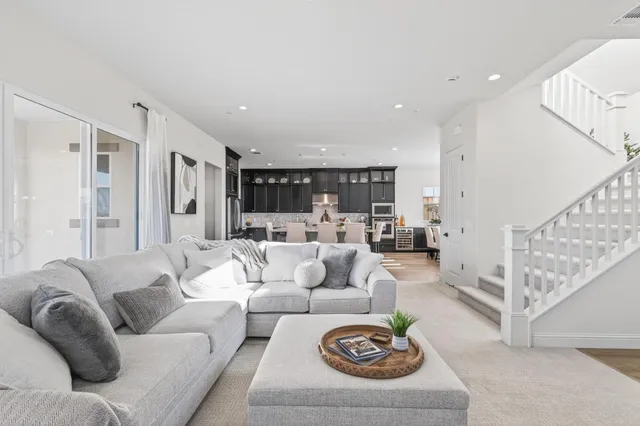 a living room with furniture and a table