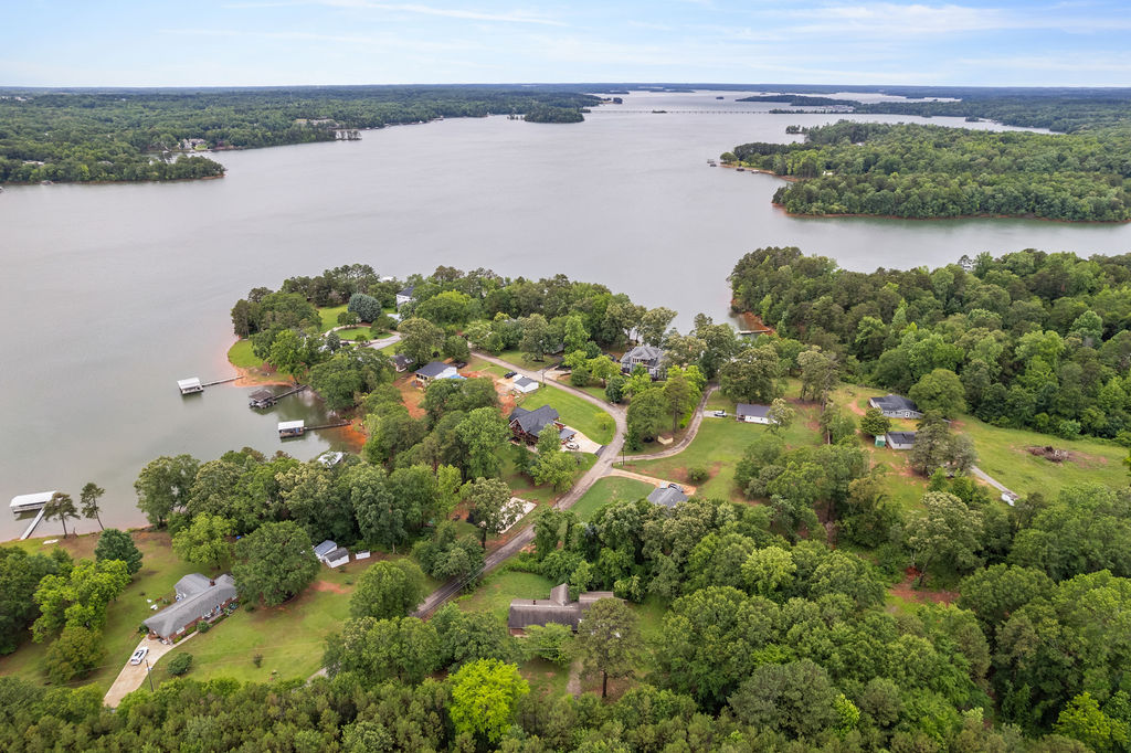 712 Whitney Way Anderson, SC 29625 - Photo 5 of 31 Discover a peaceful lakeside community with lush tree coverage and private docks along the serene waterfront.