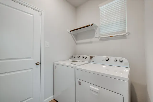 a utility room with dryer and washer