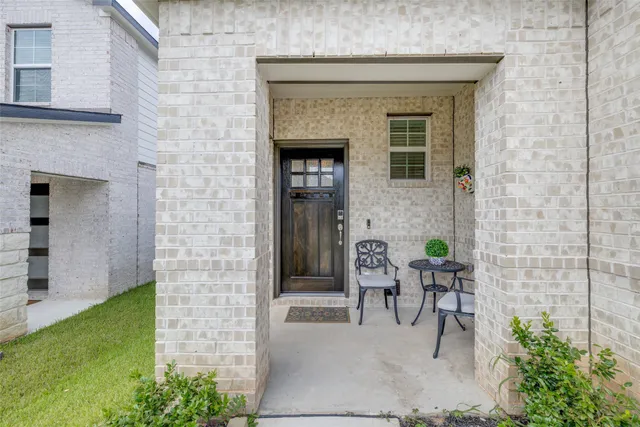 a view of house with outdoor space and porch