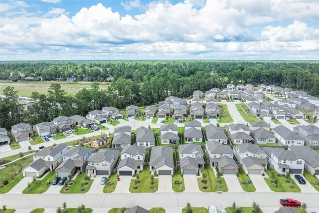 a view of multiple houses with yard
