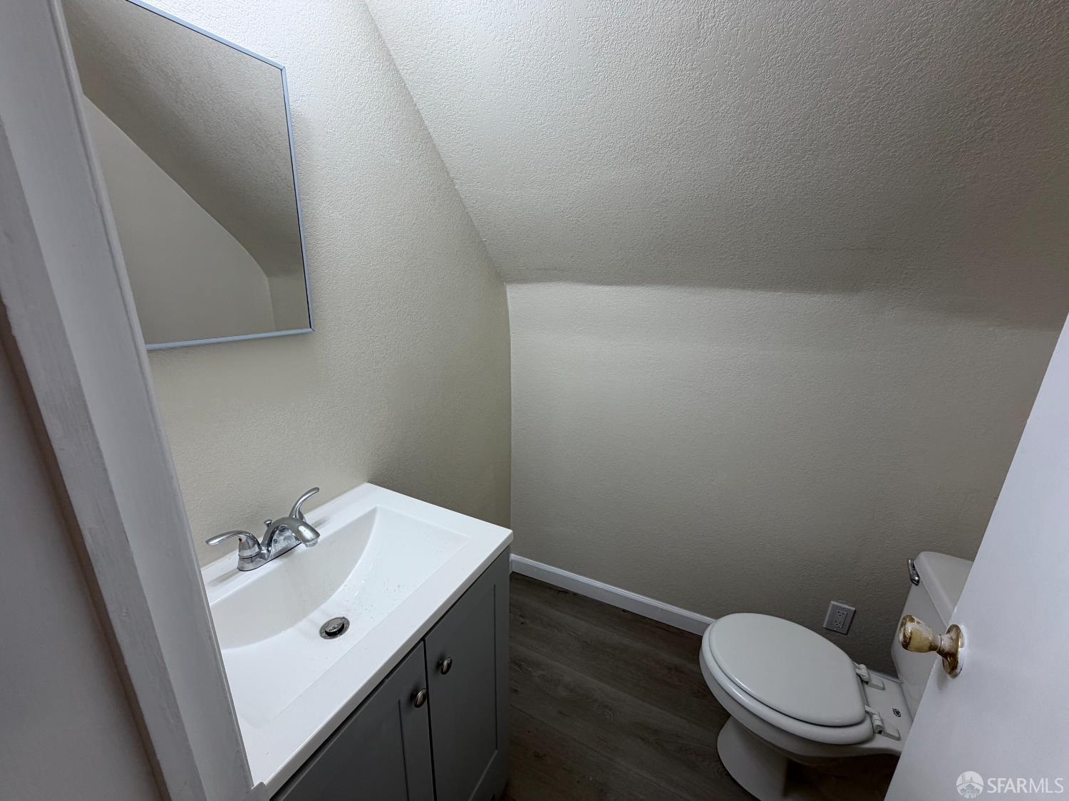 65 Minerva Street San Francisco, CA 94112 - Photo 11 of 24 a bathroom with a sink and a toilet