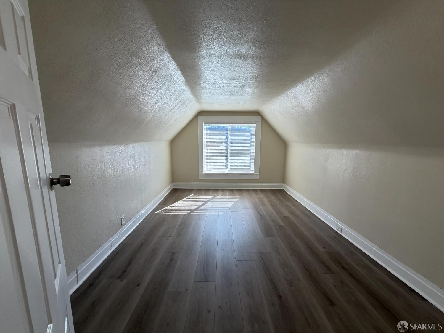 65 Minerva Street San Francisco, CA 94112 - Photo 12 of 24 wooden floor in an empty room with a window