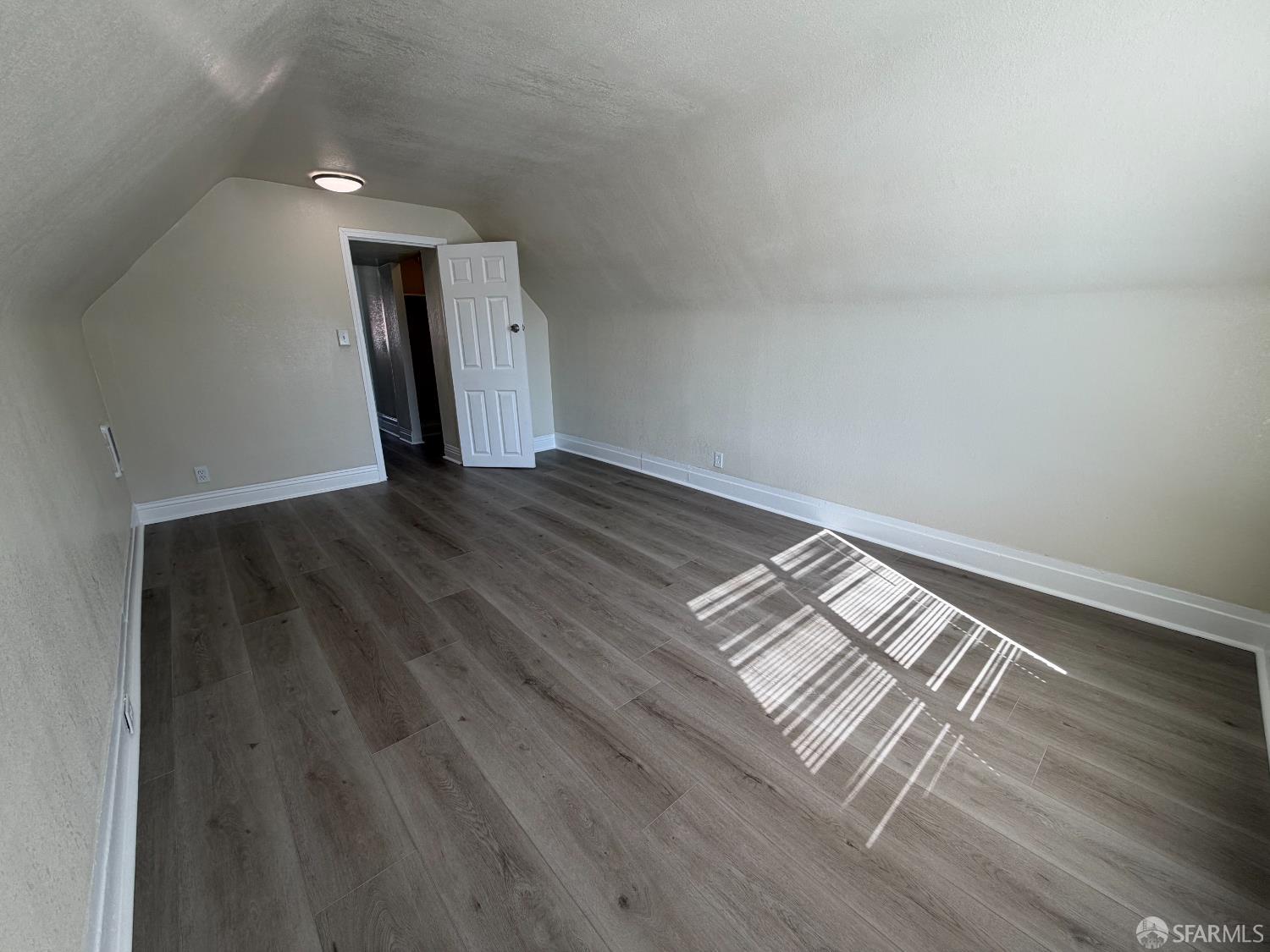 65 Minerva Street San Francisco, CA 94112 - Photo 15 of 24 a view of wooden floor and windows in a room