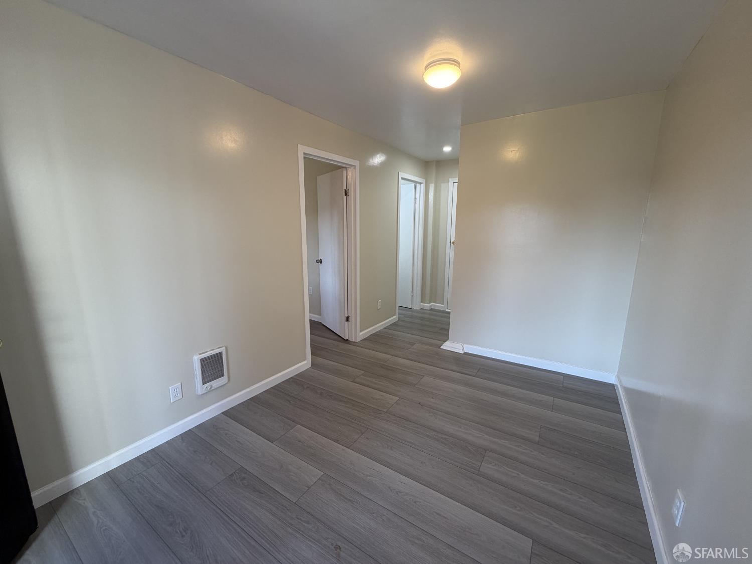 65 Minerva Street San Francisco, CA 94112 - Photo 16 of 24 a view of an empty room with wooden floor