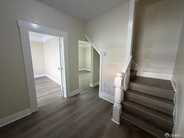 a view of entryway with wooden floor