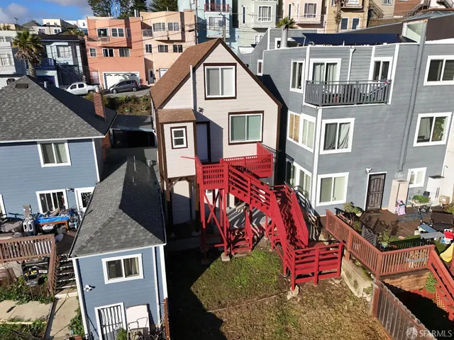 an aerial view of a city with lots of residential buildings