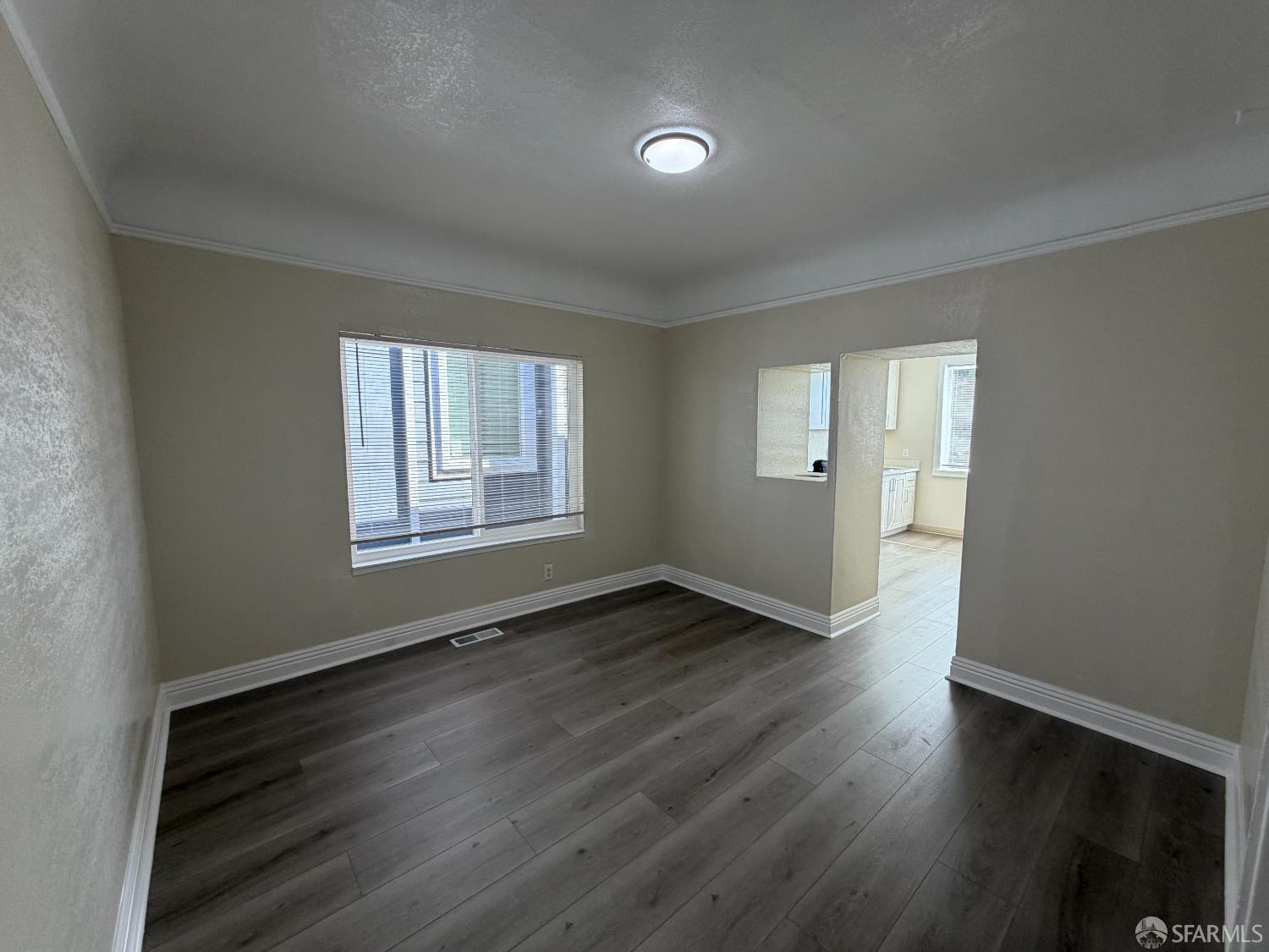 65 Minerva Street San Francisco, CA 94112 - Photo 4 of 24 a view of an empty room with wooden floor and a window