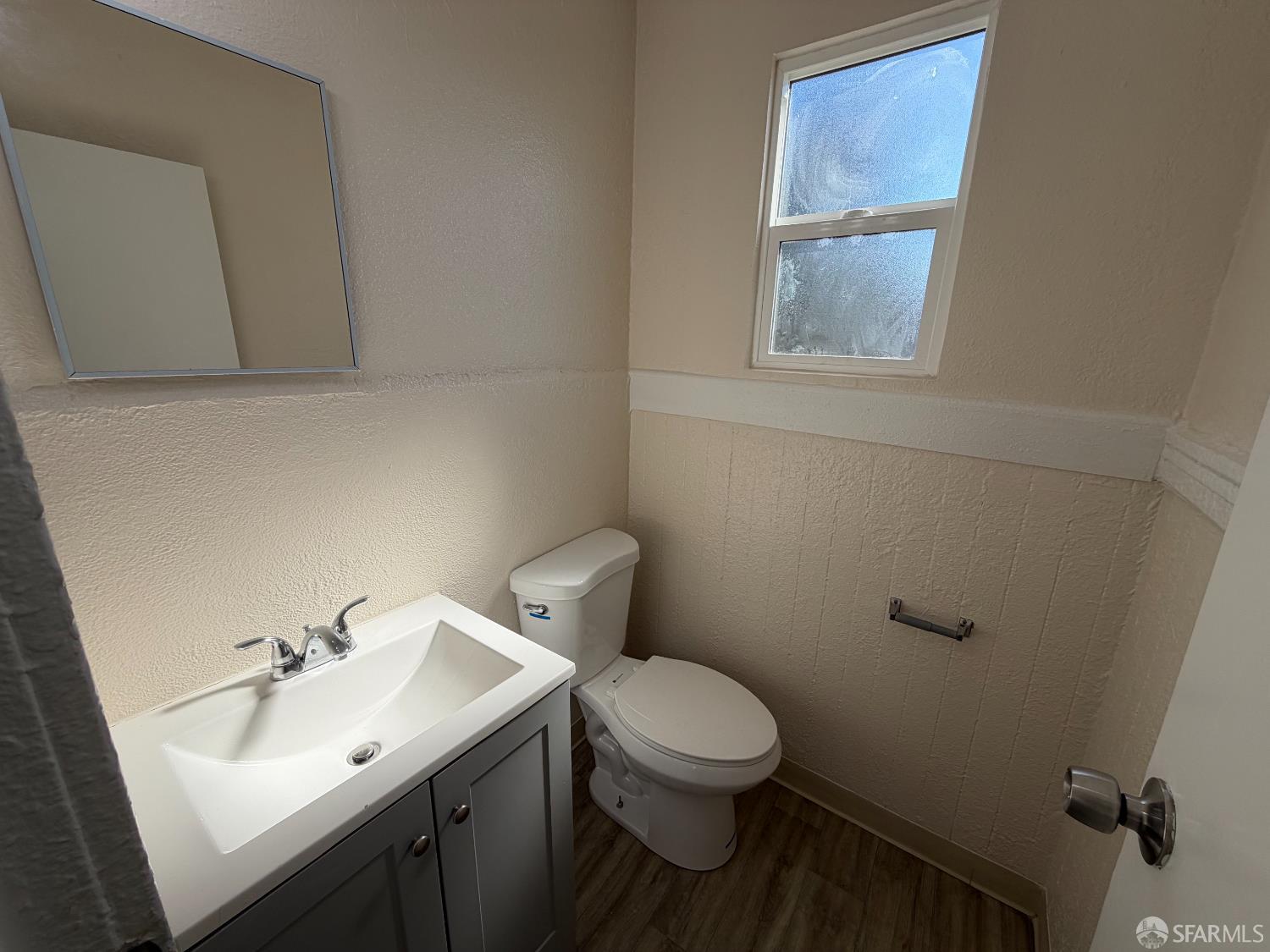 65 Minerva Street San Francisco, CA 94112 - Photo 9 of 24 a bathroom with a sink mirror and toilet