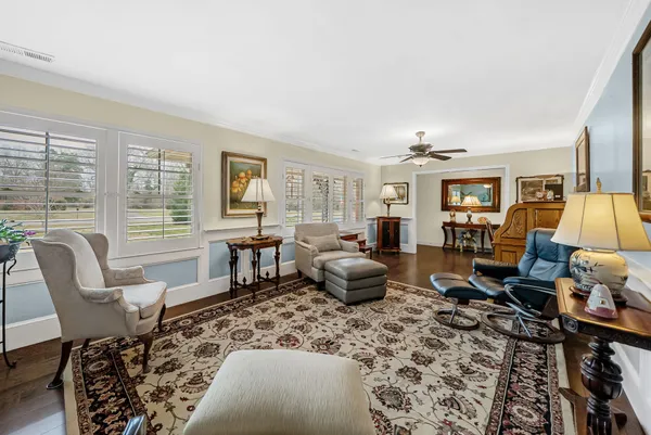 a living room with furniture or couch and two windows