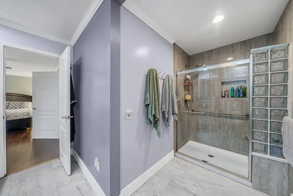 a bathroom with a shower and a sink