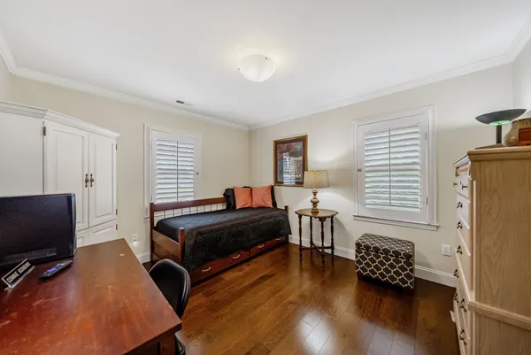 a bedroom with furniture and a window