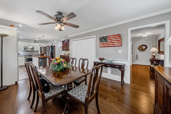 a view of a dining room with furniture and wooden floor