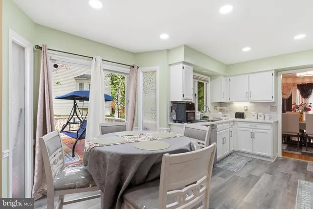 a kitchen with a stove a sink and a refrigerator