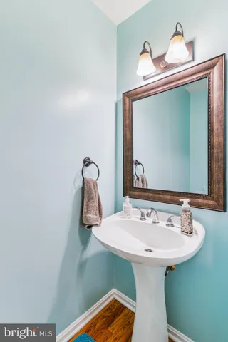 a bathroom with a sink and mirror