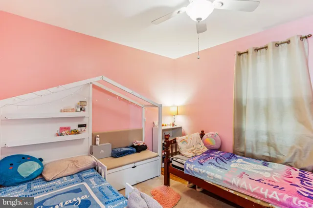 a bedroom with furniture and a wooden floor