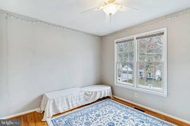 a bedroom with bed and a window