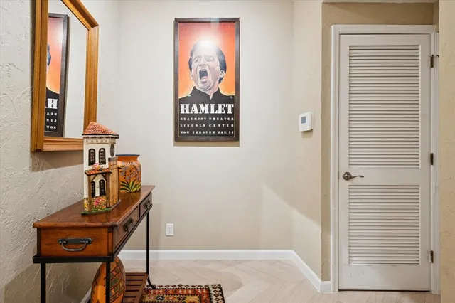 a view of a door and chair in a room
