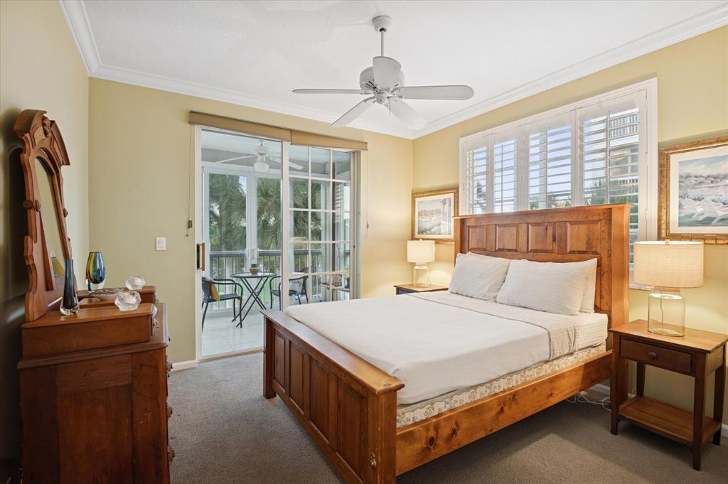 4112 West Palm Aire Drive, Unit 124A Pompano Beach, FL 33069 - Photo 12 of 19 a bedroom with a bed and a flat tv screen