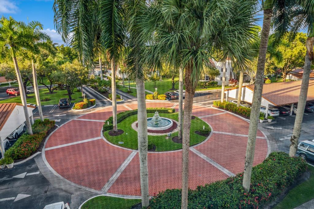 4112 West Palm Aire Drive, Unit 124A Pompano Beach, FL 33069 - Photo 15 of 19 an aerial view of a house with garden space and swimming pool