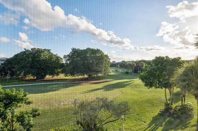 a view of a water fountain and a big yard