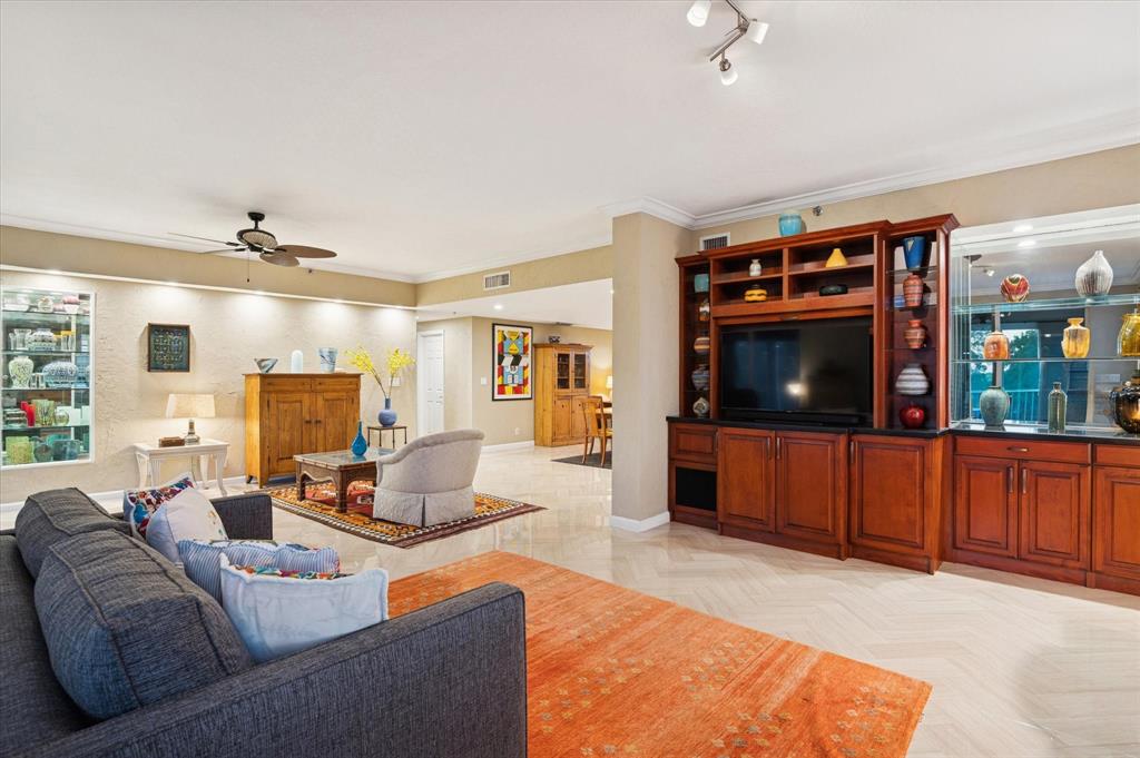 4112 West Palm Aire Drive, Unit 124A Pompano Beach, FL 33069 - Photo 3 of 19 a living room with furniture and a flat screen tv