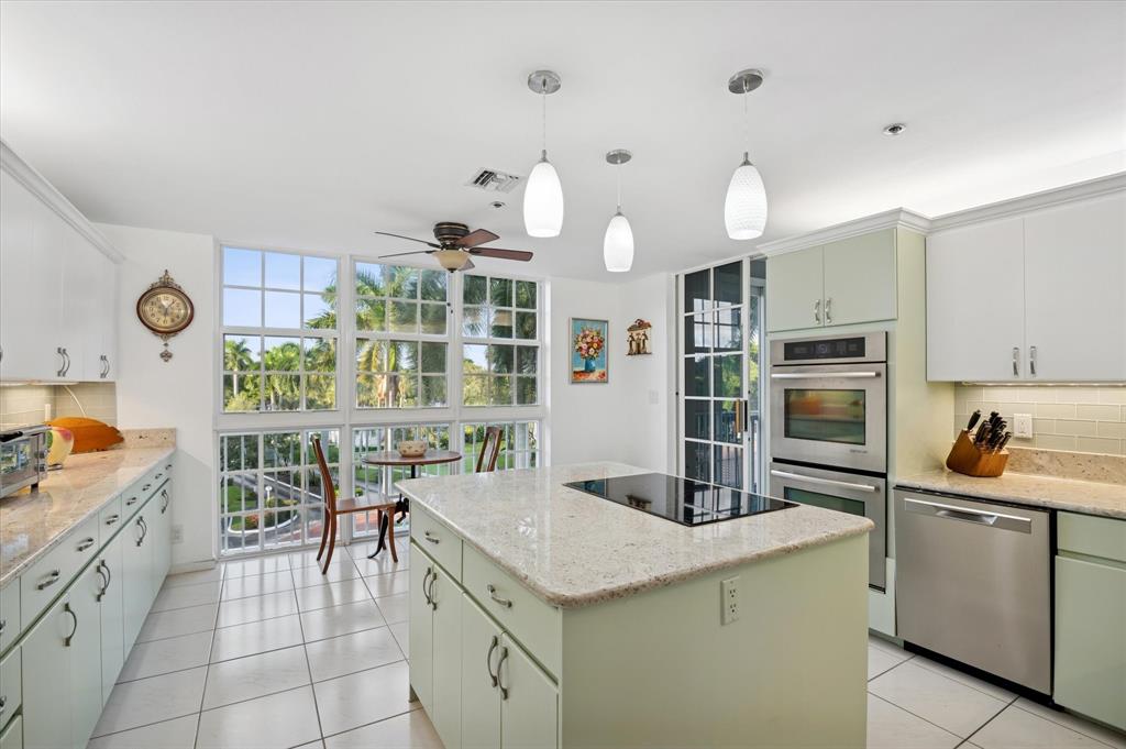 4112 West Palm Aire Drive, Unit 124A Pompano Beach, FL 33069 - Photo 7 of 19 a kitchen with a sink and cabinets
