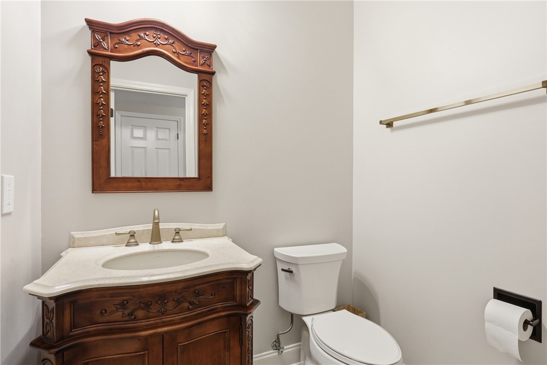 103 5 Knoll Court Anderson, SC 29621 - Photo 25 of 33 A graceful vanity with an ornamental mirror enhances this elegant powder room.